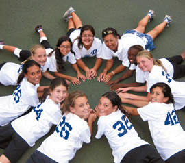 Trinity Christian School's girls volleyball Lions (grades 4-6) celebrate a recent win over their Kamehameha opponents. They are (clockwise from top right corner) coach Carole Chong, Rhea Elcock, Grace Anderson, Emma Green, Cheyne Martinez, Devon Cable, Kattie Gomes, Kanani Lyons, Sophia Morgan, Rilla Bretz and Brittney Bayot. Photo by Keikilani Lyons.