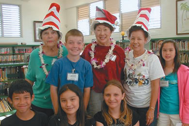 Virginia De Castro, Charlotte Muraoka and Sue Costales (back, in hats) with their student helpers