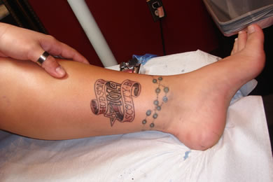 The tattoo (Hudson and Scotty B with the Star 101.9 logo) was a prize she won from the radio station