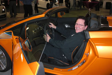 That's John Berger in an orange Lamborghini Gallardo priced at $278,010.