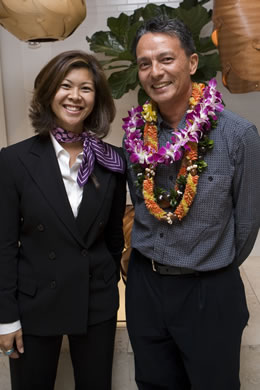 Lori Uehara, general manager at Coach Honu store, with artist Mark Chai.