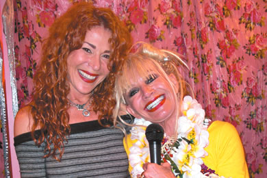 Betsey Johnson Hawaii area manager Marilee Mattson shares a hug with Betsey, 