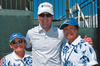 Last year's Sony Open in Hawaii winner Zach Johnson is greeted at the end of his round by volunteers