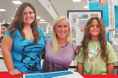 Professional surfer Bethany Hamilton stopped at Sports Authority on Ward Avenue March 25 