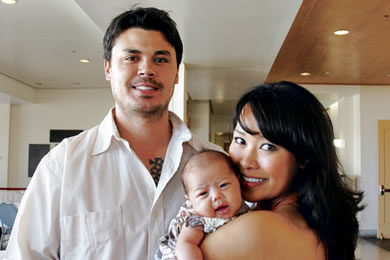 Alyssa with husband David and their 2-month-old baby girl Mila.