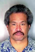 Arnold L. Kamaile Hawaiian male, 48, 5 ft. 9 in., 195 pounds, gray hair, brown eyes. Tattoo: Spider web on left hand, barbed wire on left forearm, spider on left side of neck