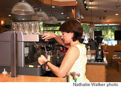 Teppi Waxman, The Coffee Bean and Tea Leaf’s director of operations, prepares a coffee drink