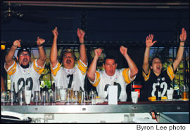 Touchdown Steelers!: Mike Foster, Eric Zotter, John Zobrak and Lindsay Bloch celebrate a score
