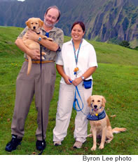 Hawaii State Hospital rehabilitation director Kim Meyer, Ph.D. holding Zane while occupational therapist Tiffany Hamaguchi holds Zoe