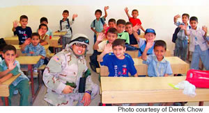 Derek Chow, a Civil Works project manager from the Honolulu Engineer District, interrupts an Al Nidhamniya School class for a construction inspection. Chow served four months at Forward Operating Base Danger near Tikrit