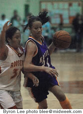 Shanadee Canon drives to the hoop against Roosevelt