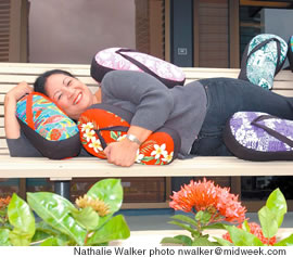 Laleen Ramsical cuddles up with her colorful slipper pillows