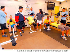 Hannah Hargis, Mari Miyashiro and Justyn Houser work out under the watchful eyes of teachers, from left, Kelvin Wong, Ben Ayson, Natalie Hirata, Chris Justo and Nathan Houghtailing