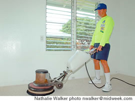 Byron Kitkousky demonstrates how to use one of his heavy-duty vacuums during a recent carpet cleaning job in Kailua