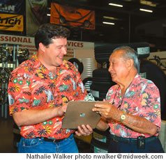 Williams checks with senior salesman Allan Inaba