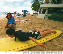 Cherry Fu, Girls Who Surf instructor, gives step-by-step instruction to the author, a ‘baby surfer’