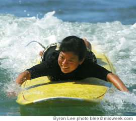 The author paddles out to catch her first wave