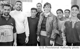 Gov. Linda Lingle during a February 2004 Iraq visit with Iraqi factory workers. Note her protective vest