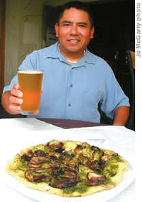Brew Moon GM Fred Gore with a microbrew and wild mushroom pizza
