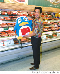 Koji Suganuma and DonPen, here in the meat department, offers shelves stacked high with new goods