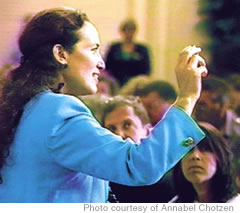 Chotzen holds up a kukui nut during a presentation she made at a Tupperware convention, held at the Hilton Hawaiian Village