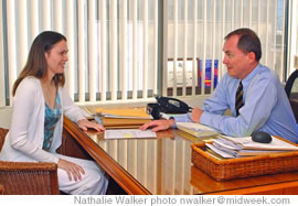 Discussing a case: Coates & Frey attorneys Jessi Hall (left) and Thomas Farrell are hard at work