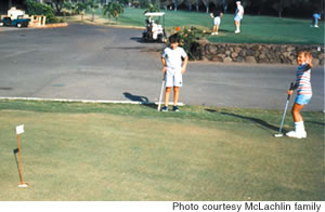 McLachlin, right, sinks a putt during his first golf lesson at age 8