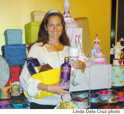 Nalani Holliday is surrounded with some of her favorite things at her Ward Centre boutique, Red Pineapple