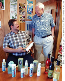 Oils of Aloha president Matthew Papania discusses products with owner Dana Gray