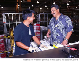 Ishizaki chats with delivery barcode sorter Scott Kong