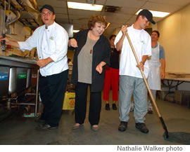 Julie Ahue Murray of Abilities Unlimited works with clients Edward Antonio, left, and Kip Vanderhoop