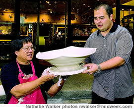 Jeff Chang and son Cory outside his downtown gallery during a First Friday Hawaii Gallery Walk