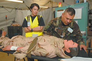 Chaplain Paul Castillo comforts a victim with Sgt. Belen De Leon