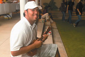 Marcus Gonzalez picks his ukulele