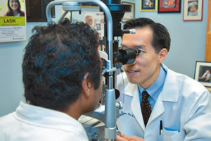 Dr. Hu takes a closer look during a routine eye exam