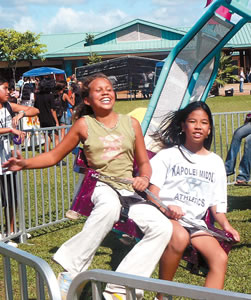 Friends enjoy a ride together at a past Kapolei Middle School Fall Festival. This year’s festivities take place Friday. Photo courtesy of the school.