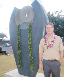 Artist Nicholas Bleecker stands beside his granite scultpure He Pua Momi or The Pearl Child, which was installed at Pearl Ridge Elementary School in a Dec. 15 ceremony. Photo by Lisa Asato.