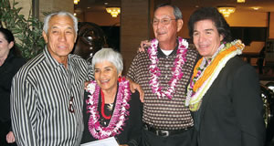 Janice and Albert Choy (center) who were congratulated during Danny Couch’s performance for being married longer than anyone in the room, meet after the show with special guest Danny Kaleikini (left) and Couch. Photo by Rasa Fournier.