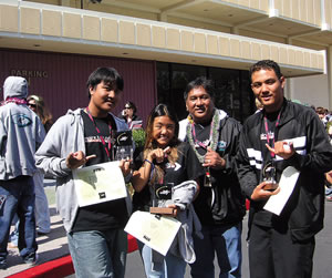 Student Television Network competition winners from Kapolei High School’s Graphics Academy (from left) Randy Salazar who took first place for Graphics Design, and the winners of the Stand-Up Reporting category, Chaleesa Abrazado and Mychal Banis, flanking Daryl Madela. Photo courtesy of the Kapolei High School Graphics Academy.