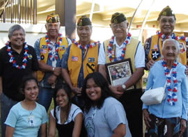 Filipino Regiment members (back, from left) Bernard Jacang, Placido Espino, Guillermo Alejo, Domingo Los Banos and Abilino Bagayas along with his 93-year-old mother, Martha Bagayas, attend a drama performance by Aiea Intermediate eighth-graders (front) Juvilyn Sanico, Dianne Dugan and Junelyn Dela Calzada. Photo courtesy of Aileen Moriwake.
