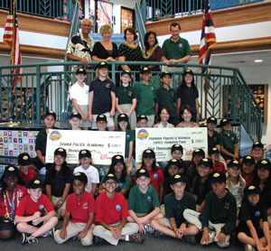 Celebrating Island Pacific Academy’s $10,000 win are (top row) state Sen. Mike Gabbard, school president Sue Miller, Luann Sackrider, Lisa Fabro, headmaster Dan White, (middle) Kelly Perry of Waimea Valley Audubon Society and Colleen Haviland of Malama Popoki, as well as the IPA fourth-grade winners. Photo courtesy of Island Pacific Academy.