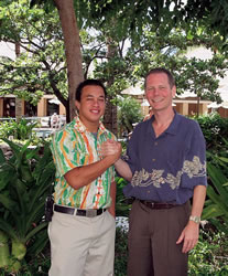 Kapolei High School graduate and Ko Olina intern Royce Cummings shakes hands with Chad Jensen, general manager of Marriott’s Ko Olina Beach Club. Photo courtesy of the beach club.