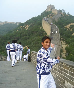 Ronald Susa, a tenor saxophone player with the Pearl City High School band, points out the path and tower on the Great Wall that his fellow musicians “walked, ran, jogged and even crawled to” during the band’s trip to perform in the Beijing Olympic International Youth Festival. Photo from Ronald Susa.
