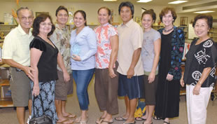 Jade Bright (fourth from left) is honored by family and DOE members as the Castle Complex Schools’ “Teacher of Promise.” With her are (from left) Ron, Moira and Michael Bright, Stephanie, Gary and Tori Anguay, Ahuimanu Elementary principal Anne Marie Duca and former district superintendent Ruby Hiraishi. Photo by Nathalie Walker